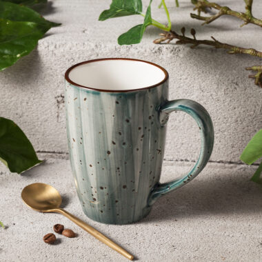 Handmade retro-style ceramic mug with colorful glazed finish