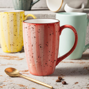 Handmade retro-style ceramic mug with colorful glazed finish
