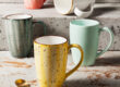 Handmade retro-style ceramic mug with colorful glazed finish