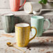 Handmade retro-style ceramic mug with colorful glazed finish