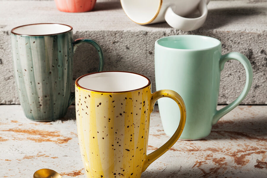 Handmade retro-style ceramic mug with colorful glazed finish