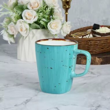 Handmade retro-style ceramic mug with colorful glazed finish