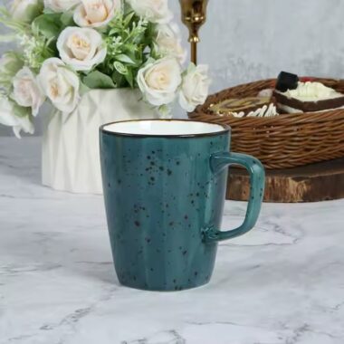 Handmade retro-style ceramic mug with colorful glazed finish
