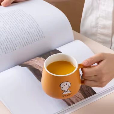 Cute high-quality ceramic coffee mug with cartoon-style design and handle