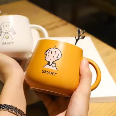 Cute high-quality ceramic coffee mug with cartoon-style design and handle