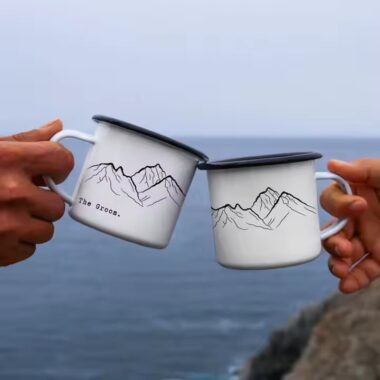 Creative vintage enamel camping mug with custom outdoor-themed artwork