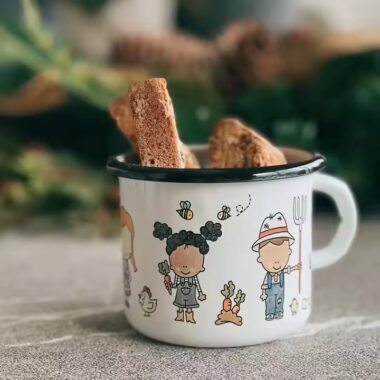 Creative vintage enamel camping mug with custom outdoor-themed artwork
