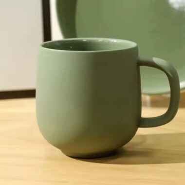 Handmade colorful clay ceramic mug with artistic texture