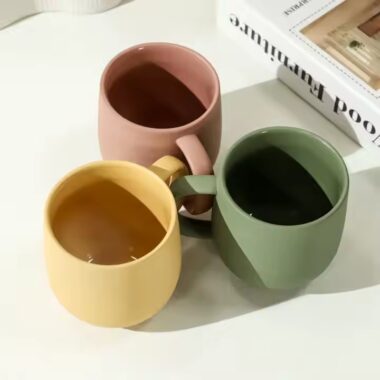 Handmade colorful clay ceramic mug with artistic texture