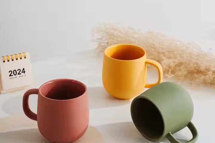 Handmade colorful clay ceramic mug with artistic texture