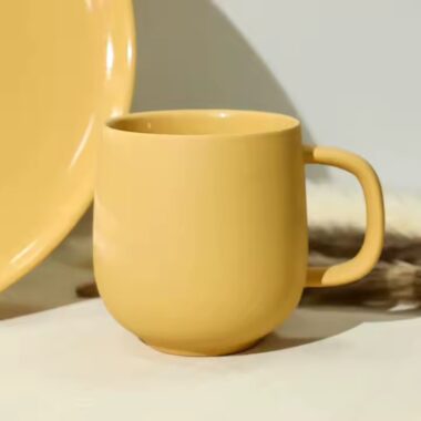 Handmade colorful clay ceramic mug with artistic texture