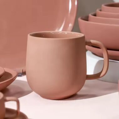 Handmade colorful clay ceramic mug with artistic texture