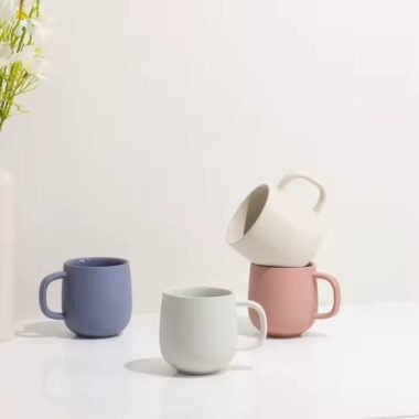 Handmade colorful clay ceramic mug with artistic texture
