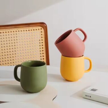 Handmade colorful clay ceramic mug with artistic texture