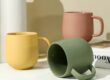 Handmade colorful clay ceramic mug with artistic texture