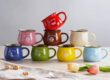 Retro-style ceramic coffee mug with creative handle and glazed finish